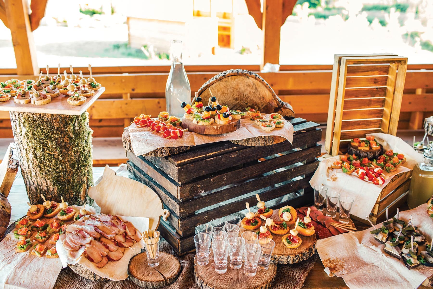 Beautifully decorated catering banquet table with different food snacks and appetizers on corporate christmas birthday party event or wedding celebration